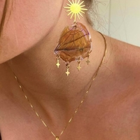 Gold earrings with butterfly wings