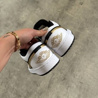 Air Jordan 1 Low “Gold Swoosh”