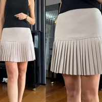 Плисирана пола в екрю с висока талия