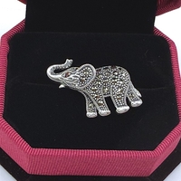 Брошка слонче с марказити и гранат