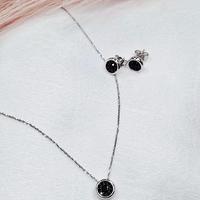 Комплект от бяло злато с черни циркони 