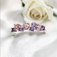 Златен пръстен с розови и лилави циркони