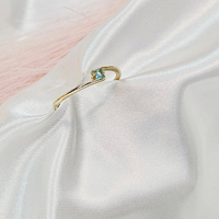 Златен пръстен със светло син циркон