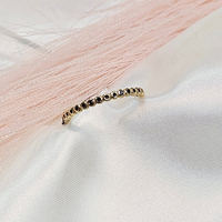 Златен пръстен тип халка с инкрустирани черни циркони