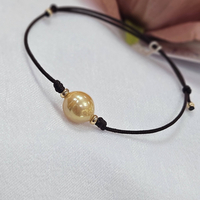 Гривна на конец с естествена, кафява перла и 18К елементи Gumon