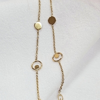 Златна гривна с кръгли, вградени елементи