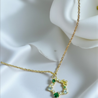 Златно колие със зелени и бели циркони