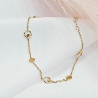 Златна гривна с кръгли, вградени елементи