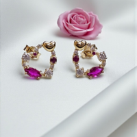 Златниобеци с цикламени циркони