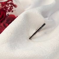 Златен пръстен от бяло злато с черни циркони, тип халка