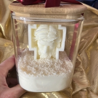 Свещ в стъклен буркан с фигура на Исус Христос