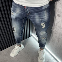 Мъжки Дънки в Синьо с Кръпки и Избелващ Ефект.