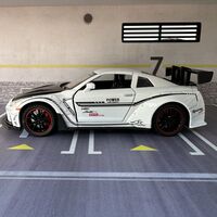 Метална кола с отварящи се врати, светлини и звуци Nissan GT-R Nismo 1:24