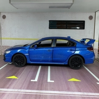 Метална кола с отварящи се врати капаци светлини и звуци Subaru Impreza 1:32