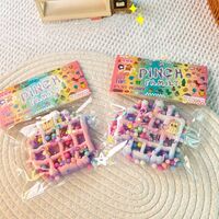 Jucarie Antistres Squishy, Flippy, cu Revenire Lenta, Squeeze Pinch Family, Model Waffle, 6x6 cm, 99g, Ambalaj Transparent, Multicolor