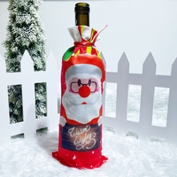 Husa Craciun pentru sticla de vin Flippy, tema Mos Craciun, material textil, 34 cm, multicolor