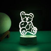 Lampa LED decorativa, Flippy, 3D, Ursulet, cu telecomanda, doua moduri de alimentare USB si baterii, 20 cm inaltime, din material acril si lumina multicolora, alb