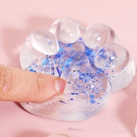 Jucarie Antistres Squishy, Flippy, cu Revenire Lenta, Squeeze Pinch Family, Model Cat Paw, 6.5 x 7 cm, din Tpr, 4-6 Ani, Model 4 Sclipici, Transparent