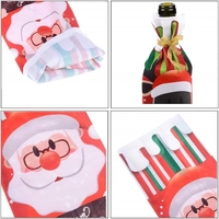 Husa Craciun pentru sticla de vin Flippy, tema Mos Craciun, material textil, 34 cm, multicolor
