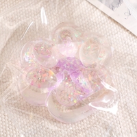 Jucarie Antistres Squishy, Flippy, cu Revenire Lenta, Squeeze Pinch Family, Model Cat Paw, 6.5 x 7 cm, din Tpr, 4-6 Ani, Model 2 Flori, Transparent