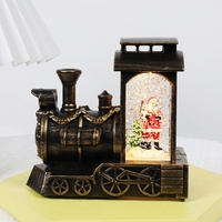 Decoratiune de Craciun tip Locomotiva, Flippy, Glob de Cristal cu Fulgi de Zapada, Model Mos Craciun, Iluminare LED, 11.5 x 12.5 x 6 cm, Carcasa Vintage Bronze, Transparent