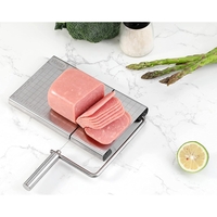 Feliator manual Flippy, pentru cascaval, salam, prajituri, unt, din otel inoxidabil, usor de curatat si utilizat, 5 lame de schimb incluse, picioare antiderapante, 21 x 12.2 x 2.8 cm, argintiu
