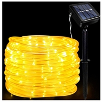 Instalatie luminoasa de Craciun cu LED, 100 LED-uri tip Tub, 12 metri lungime, 8 programe, 2 metri prelungitor, incarcare solara, alb cald, Flippy