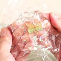 Jucarie Antistres Squishy, Flippy, Labuta de Pisica Pufoasa, cu Revenire Lenta, 7 x 6.5 cm, Model Fluturi, Multicolor