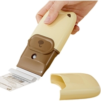 Mini Racleta de Curatare, Flippy, pentru Etichete, Adezivi, din ABS+ Metal, 2 Lame Incluse, Maro