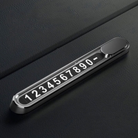 Suport Auto Numar Telefon Parbriz, Flippy, Aliaj de Aluminiu, Lipire cu Banda Dubla Adeziva, 13,8 cm, Negru