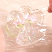 Jucarie Antistres Squishy, Flippy, Labuta de Pisica Pufoasa, cu Revenire Lenta, 7 x 6.5 cm, Model Flori 1, Transparent