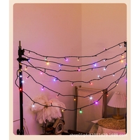 Instalatie de Craciun liniara Yoto, 10 m, din care 1 m cablu priza 220V, 100 LED, 8 jocuri de lumini, controler, fir negru, multicolor