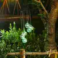 Lampa solara de tip decoratiune pentru gradina, Flippy, model clopotel de vant, alb cald