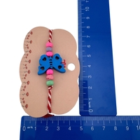 Martisor Bratara Multicolora pentru Copii, Jolie, din Lemn si Textil, Model Fluture