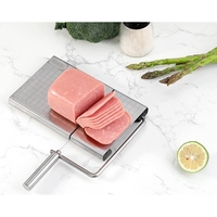 Feliator manual Flippy, pentru cascaval, salam, prajituri, unt, din otel inoxidabil, usor de curatat si utilizat, 5 lame de schimb incluse, picioare antiderapante, 21 x 12.2 x 2.8 cm, argintiu