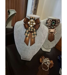 Green and brown bow brooch