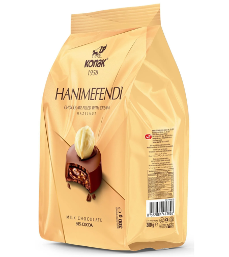 KONAK HANIMEFENDI Лешникови парченца и млечен шоколад с пълнеж 300 гр