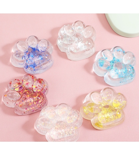 Jucarie Antistres Squishy, Flippy, cu Revenire Lenta, Squeeze Pinch Family, Model Cat Paw, 6.5 x 7 cm, din Tpr, 4-6 Ani, Model 4 Sclipici, Transparent