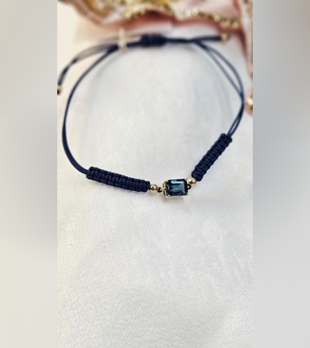 Гривна на конец с Топаз Лондон Блу и елементи от 18К злато Gumon