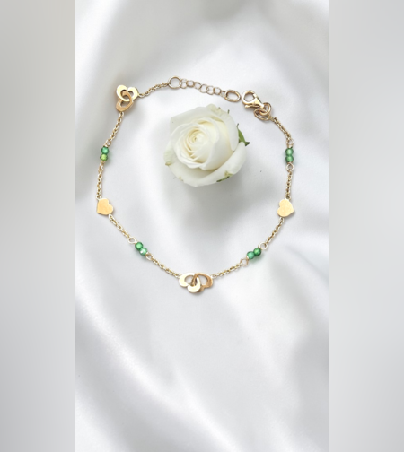 Златна гривна със сърчица и зелени цирконий