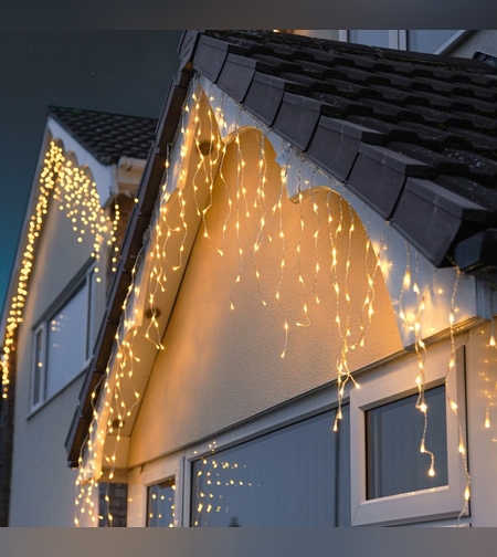 Instalatie Craciun Yoto, Tip Franjuri/Turturi, 12 m, 300 LED-uri, Prelungitor 1.5 m, 8 Jocuri de Lumini, Interconectabila, Conectare la Retea, Fir transparent, Interior/Exterior, Alb Cald