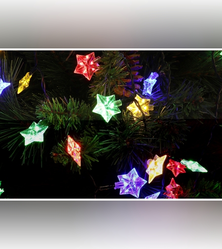 Instalatie de Craciun Liniara RGRB Yoto, 10 m, din care 1 m Prelungitor 220V, 40 LED, Model Stelute, Utilizare Interior/Exterior, Interconectabila, Fir Negru, multicolor