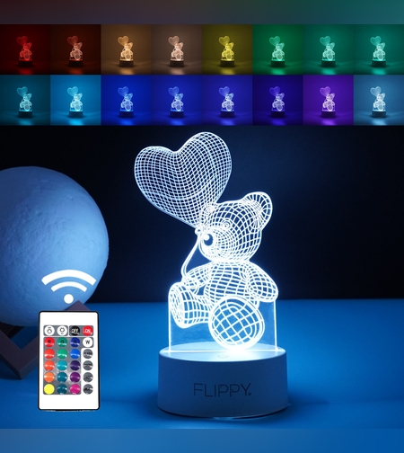 Lampa LED decorativa, Flippy, 3D, Ursulet cu balon inima, cu telecomanda, doua moduri de alimentare USB si baterii, 20 cm inaltime, din material acril si lumina multicolora, alb
