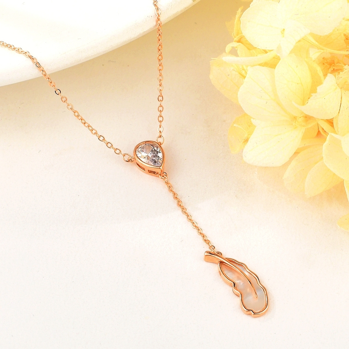 FEATHER NECKLACE ROSE GOLD PLATING