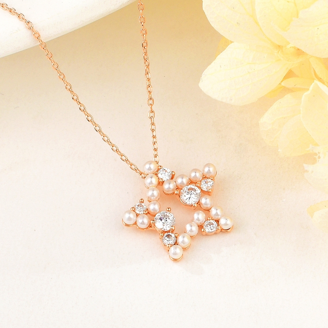 STAR NECKLACE ROSE GOLD PLATING