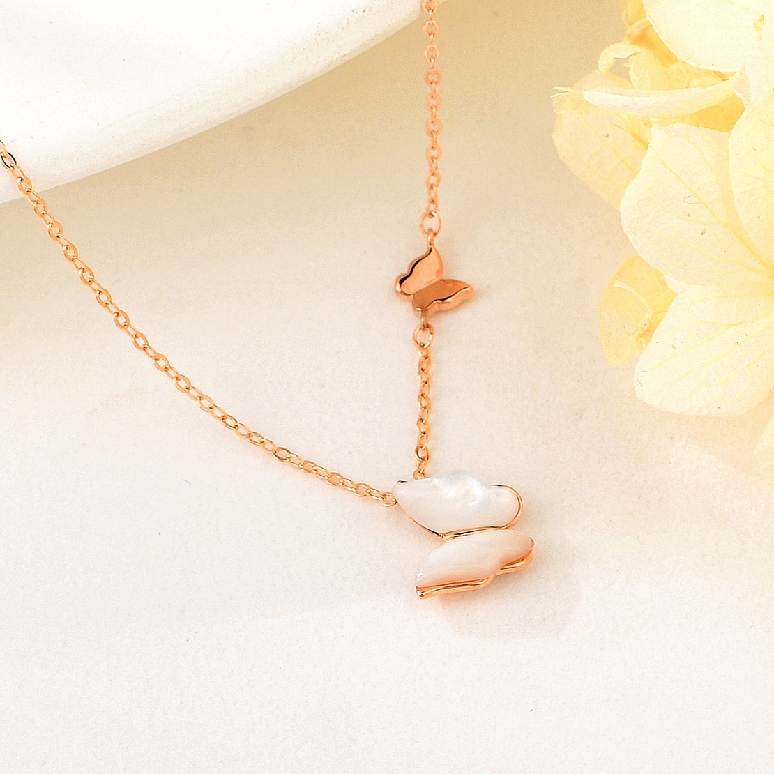 BUTTERFLY NECKLACE ROSE GOLD PLATING