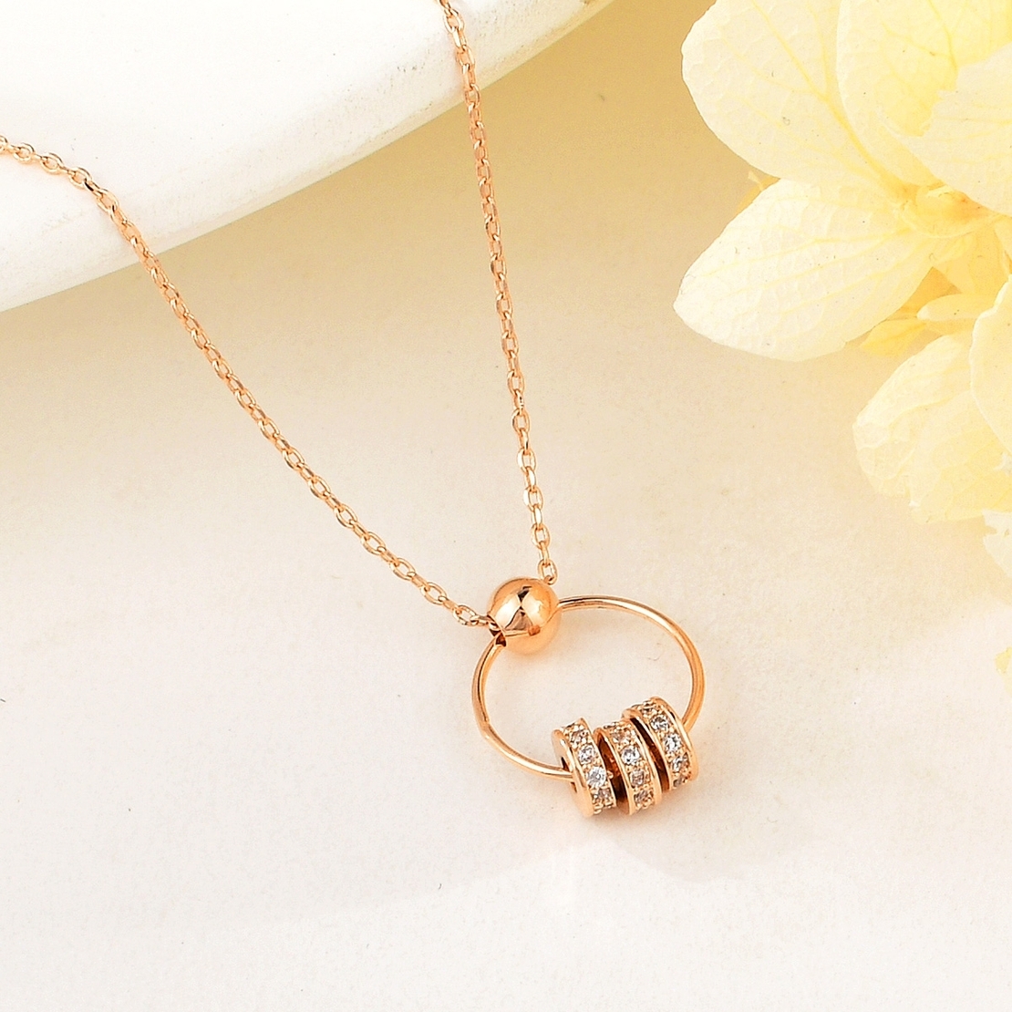 WHEELS NECKLACE ROSE GOLD PLATING