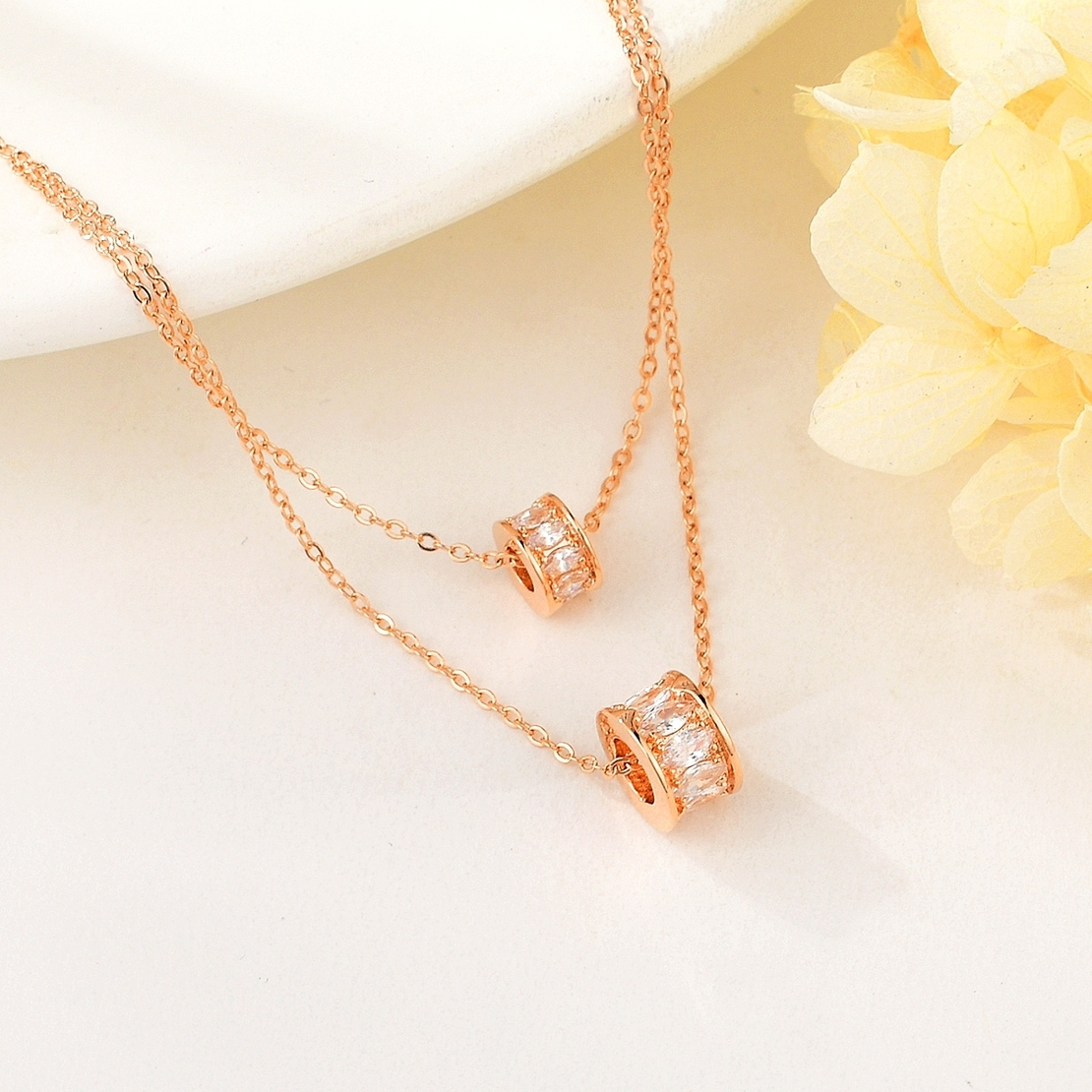 WHEELS NECKLACE ROSE GOLD PLATING