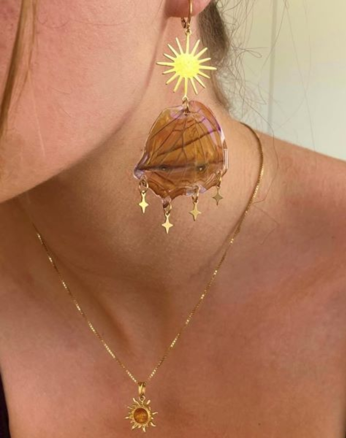 Gold earrings with butterfly wings