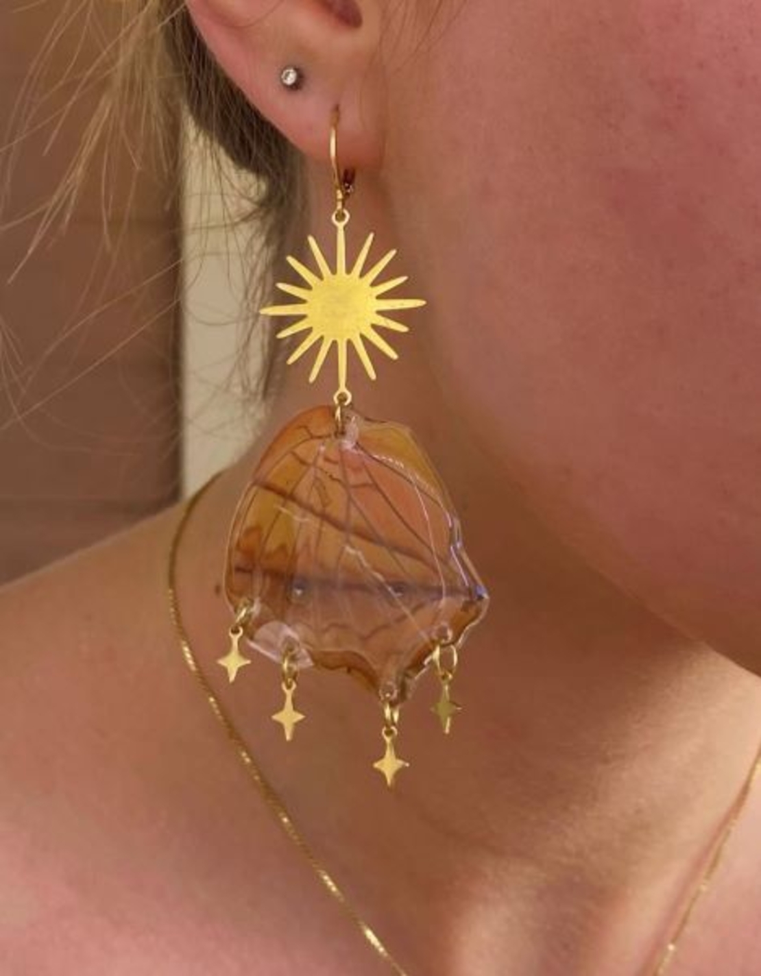 Gold earrings with butterfly wings
